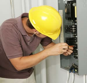 electrician-working-on-panel Electrical Panel Changeout